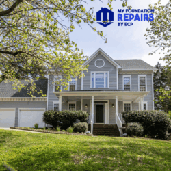 Image of a house with a large slope in the front yard. 
