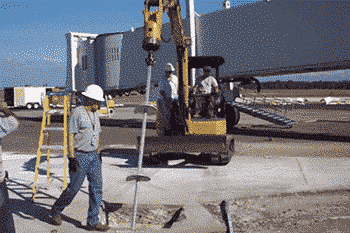 Men using machinery to install Helical Piers