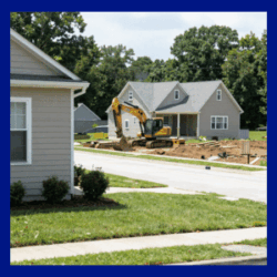 Foundation excavation in a residential neighborhood showing how urban development can impact nearby homes.